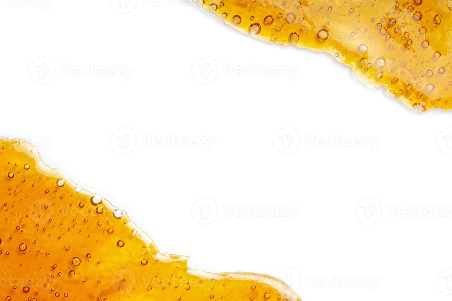 extract of gold cannabis wax with high thc, bubble shatter with place for text copy space. photo