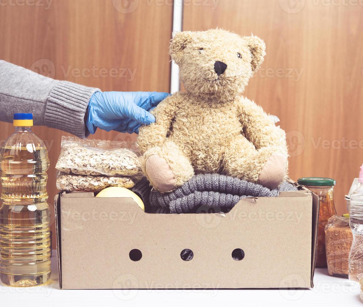 cardboard box with food and things to help those in need photo