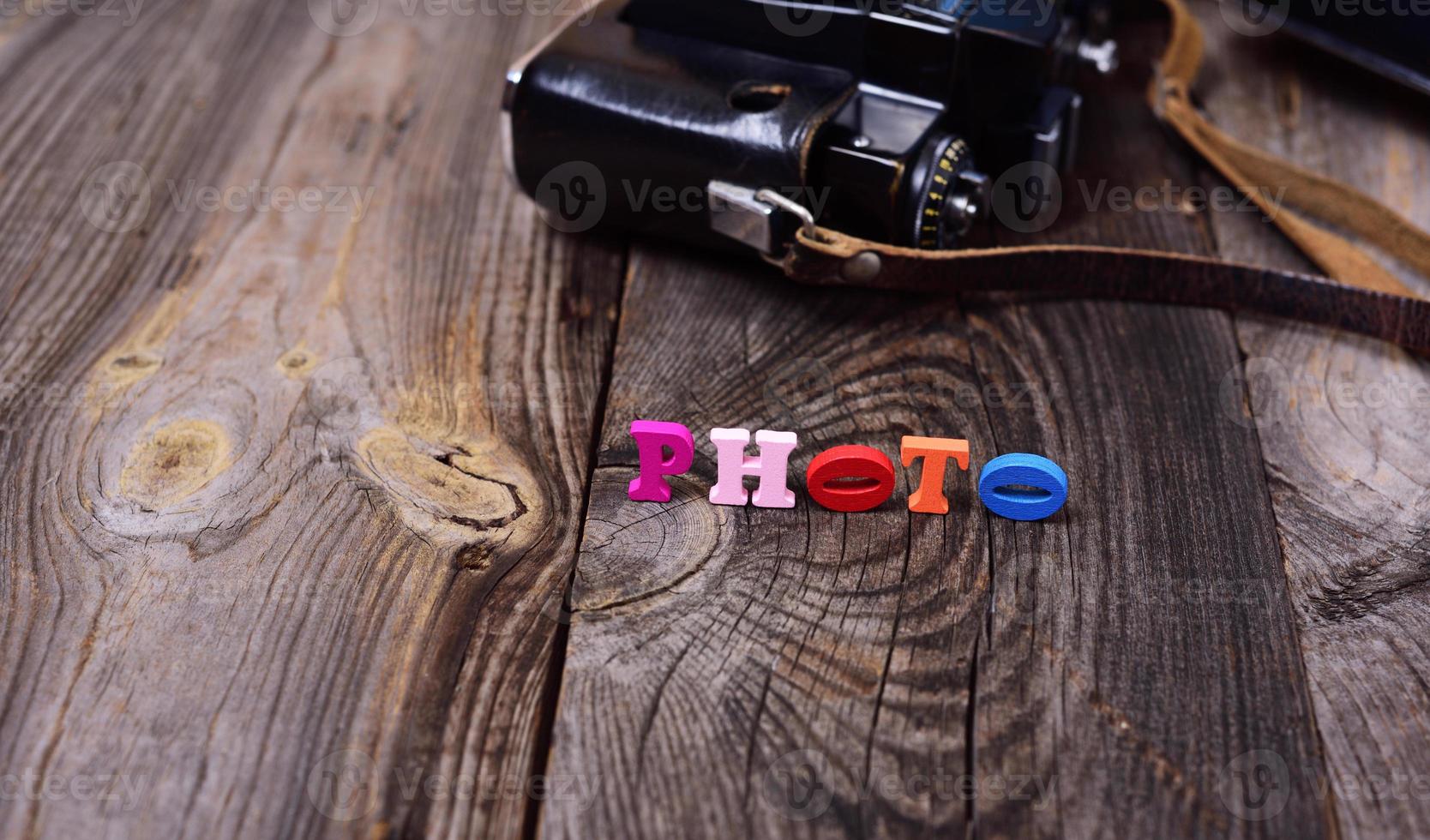 Multicolored wooden letters on a gray surface photo