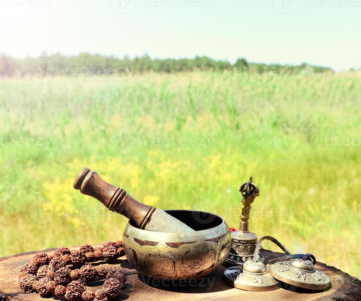 Singing a copper bowl and religious items photo