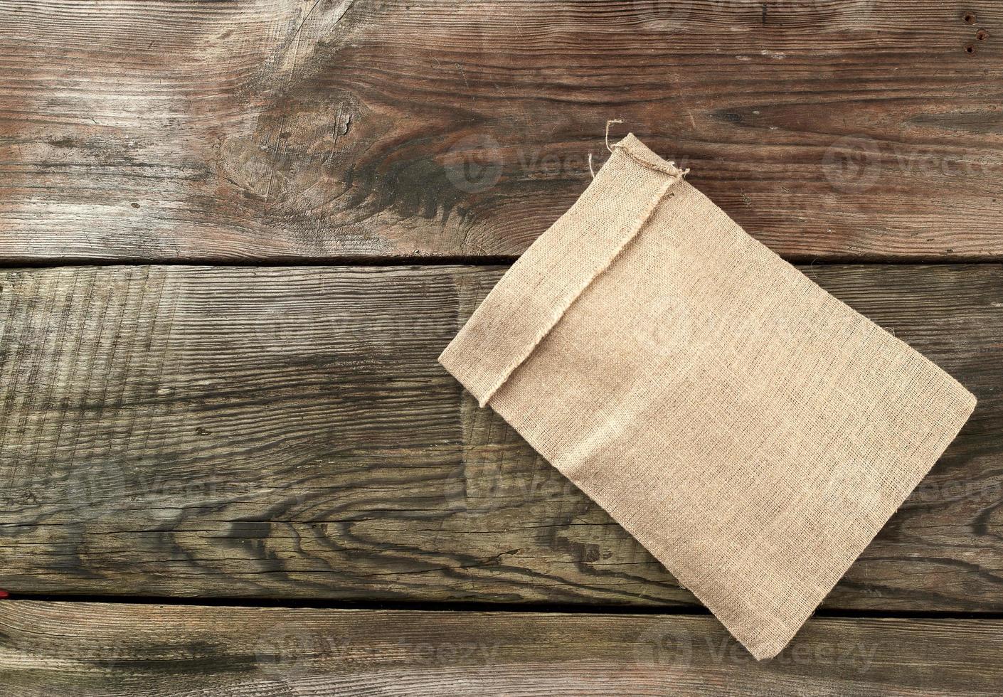 empty canvas gray bag on a wooden background from boards photo