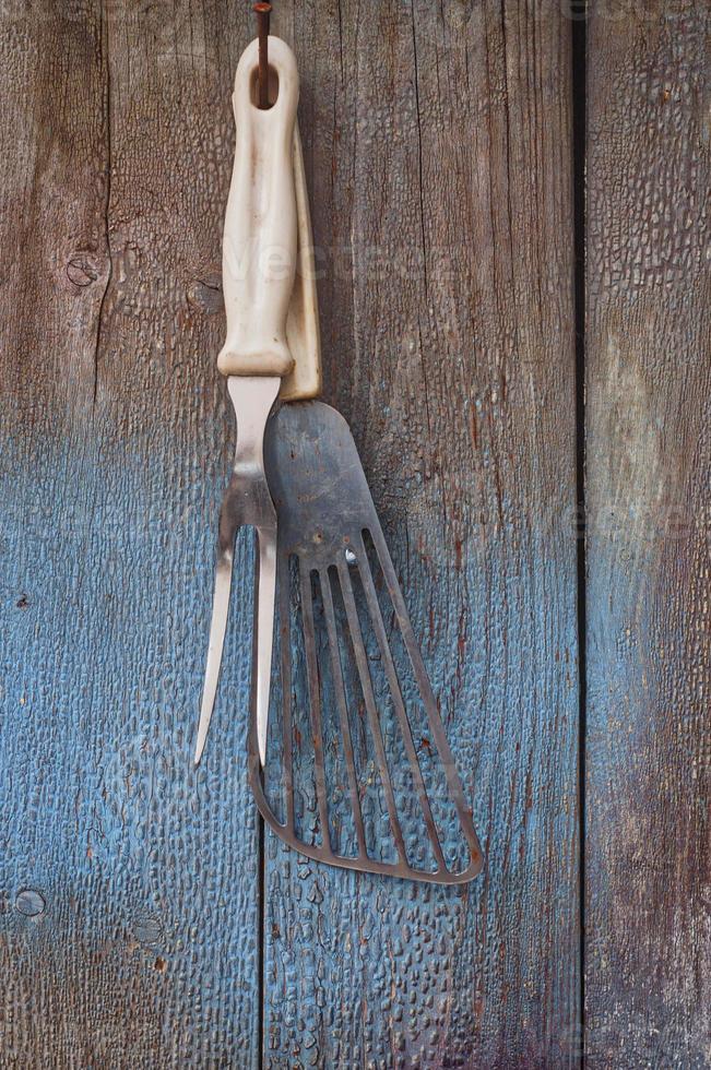 Vintage kitchen items hanging on a nail photo