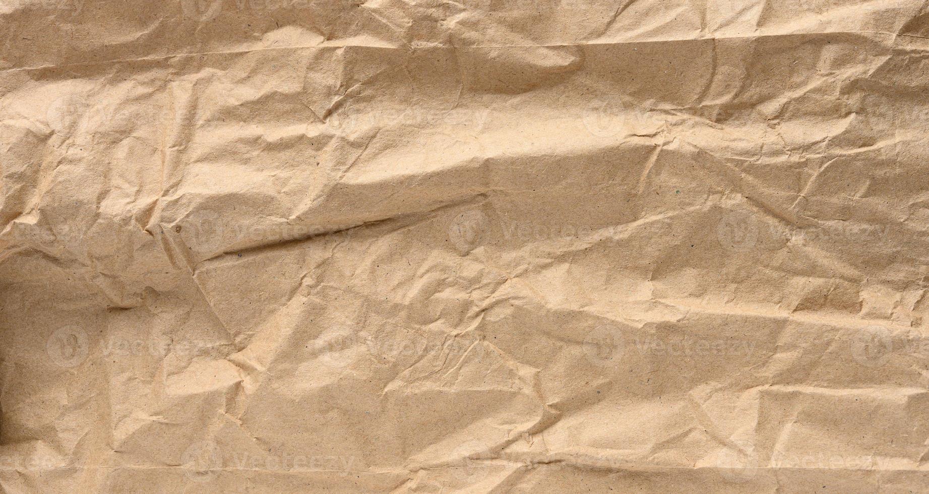Texture of brown crumpled craft paper, full frame photo