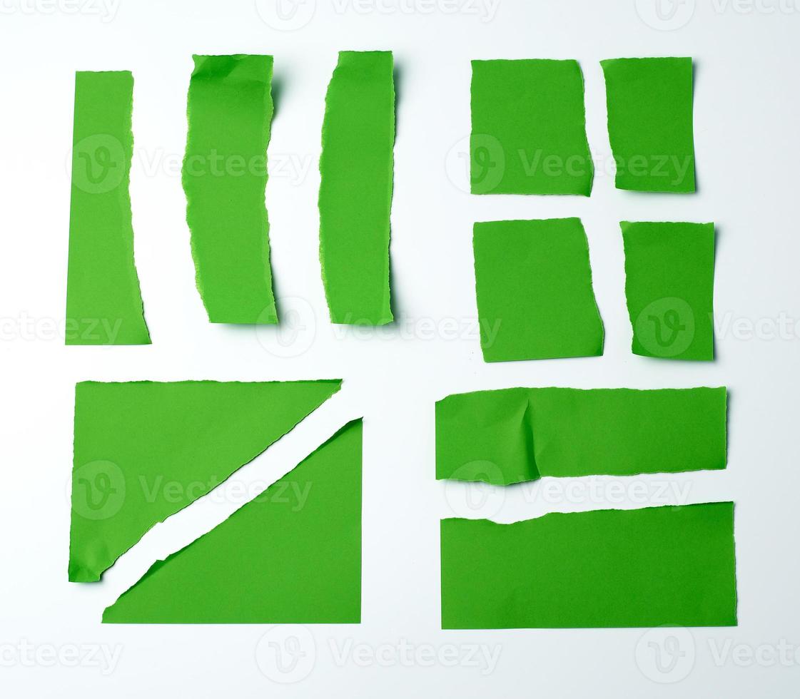 various blank pieces of green paper on white background, photo