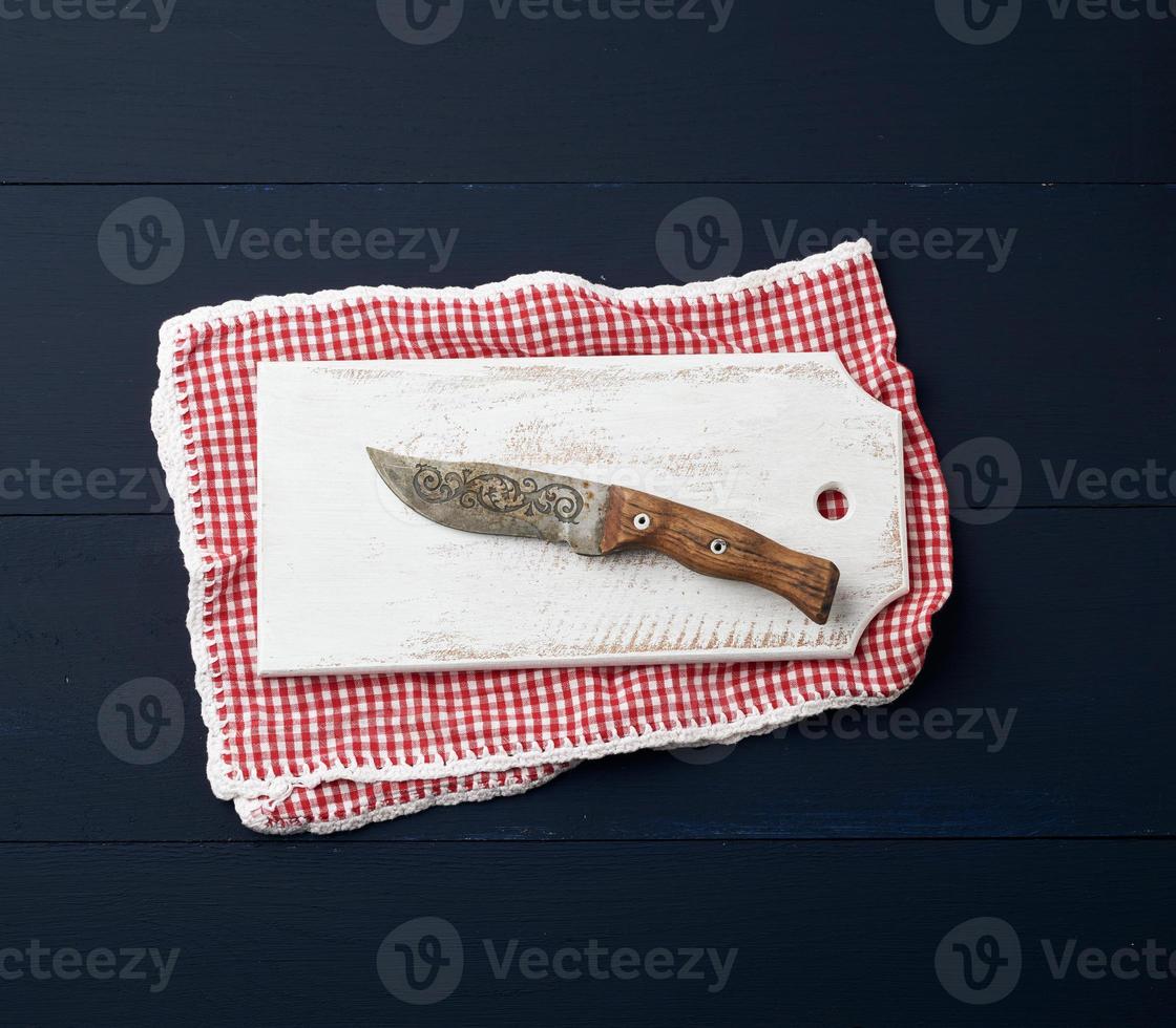 empty white wooden rectangular cutting board and knife photo
