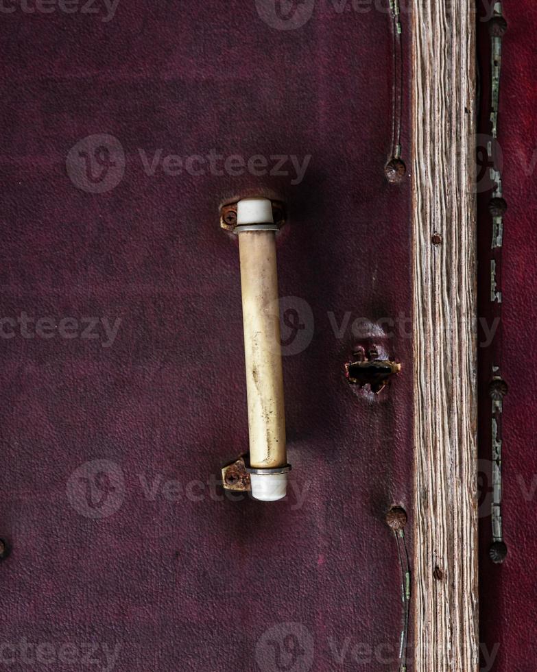 old entrance door to the room with a handle photo
