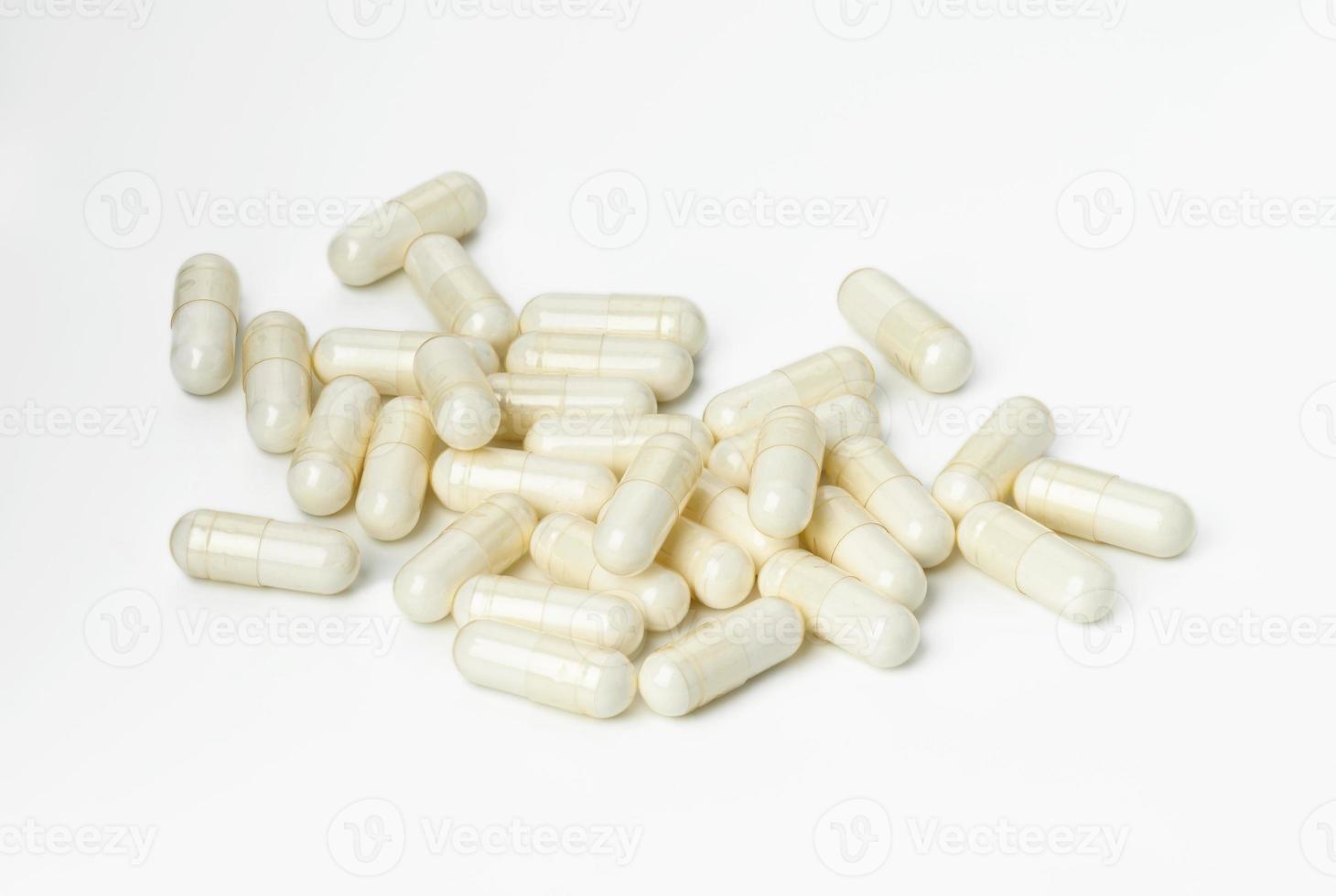 medical powder in white capsules on a white background. Treatment pills photo