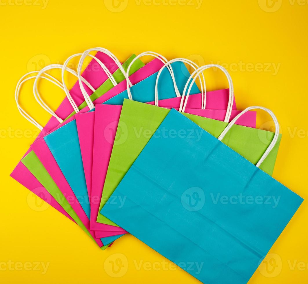 multi-colored paper shopping bags with white handles photo