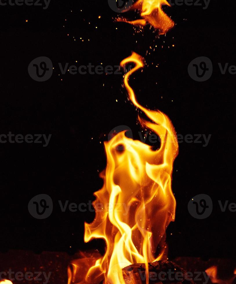 bright orange and yellow flames with sparks photo