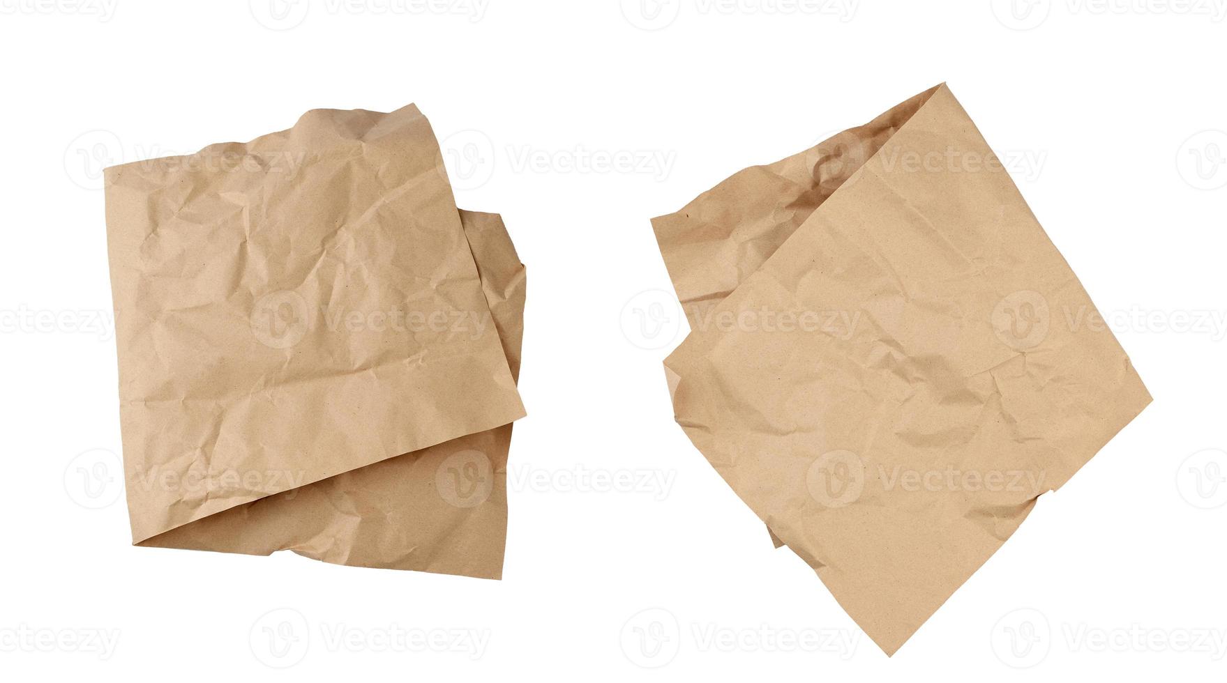 folded blank brown kraft paper sheet isolated on white background photo