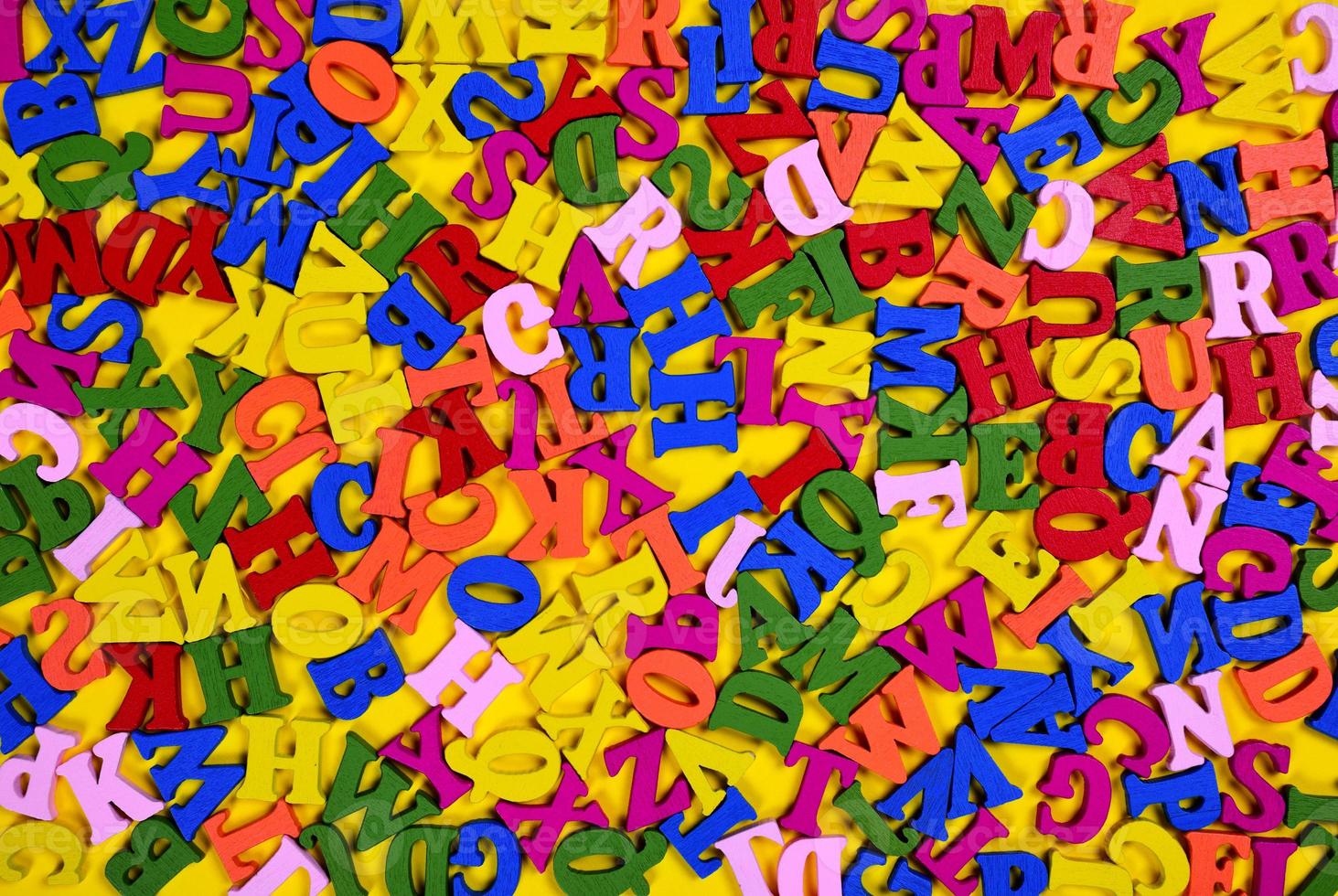 Multicolored wooden letters of the English alphabet photo