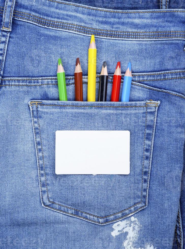 blank white business card and colored pencils photo
