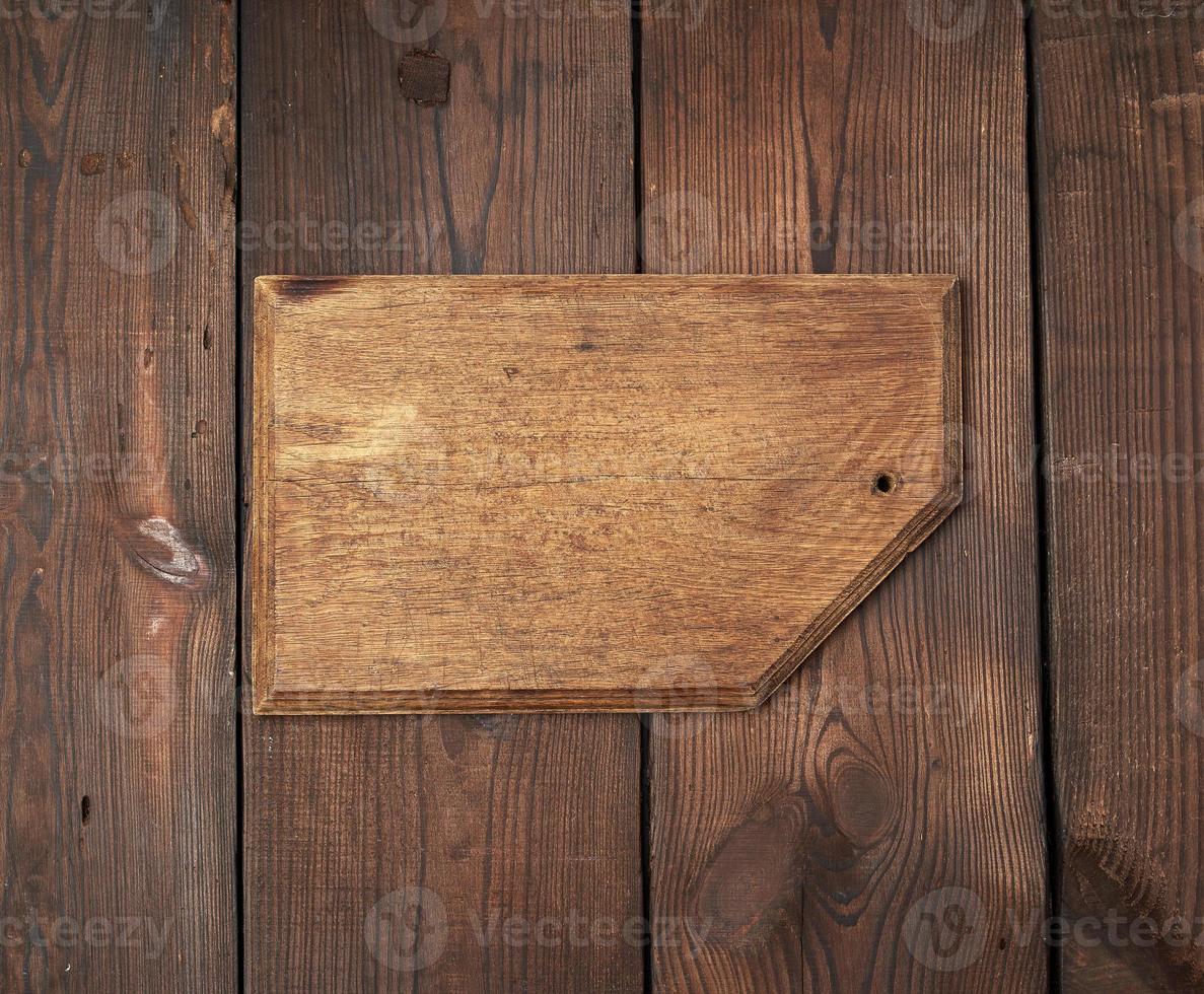 very old empty wooden rectangular cutting board, top view photo