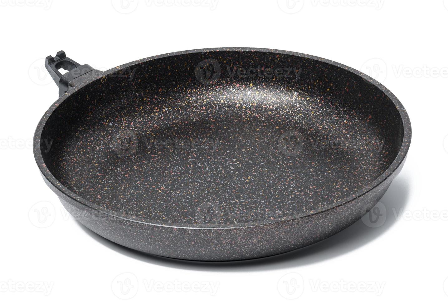 Empty black round metal plate with non-stick coating isolated on white background photo