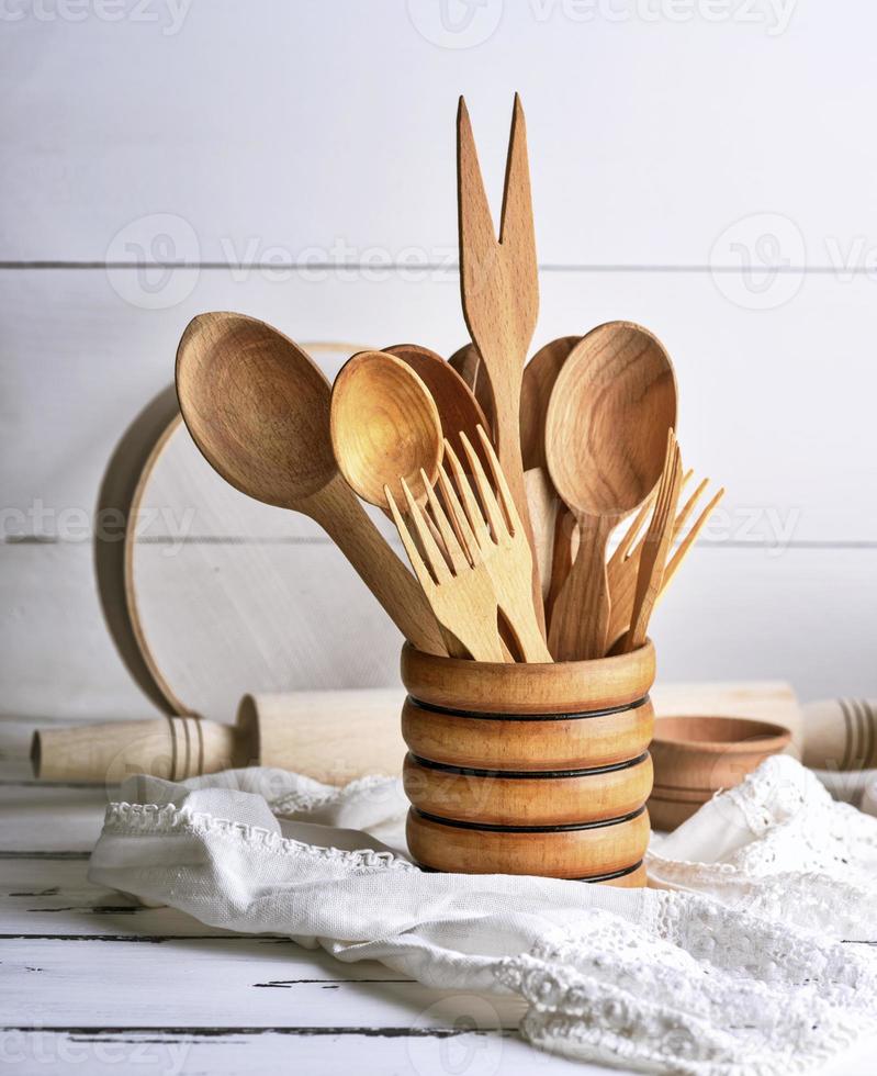 wooden spoons and forks in a wooden container photo