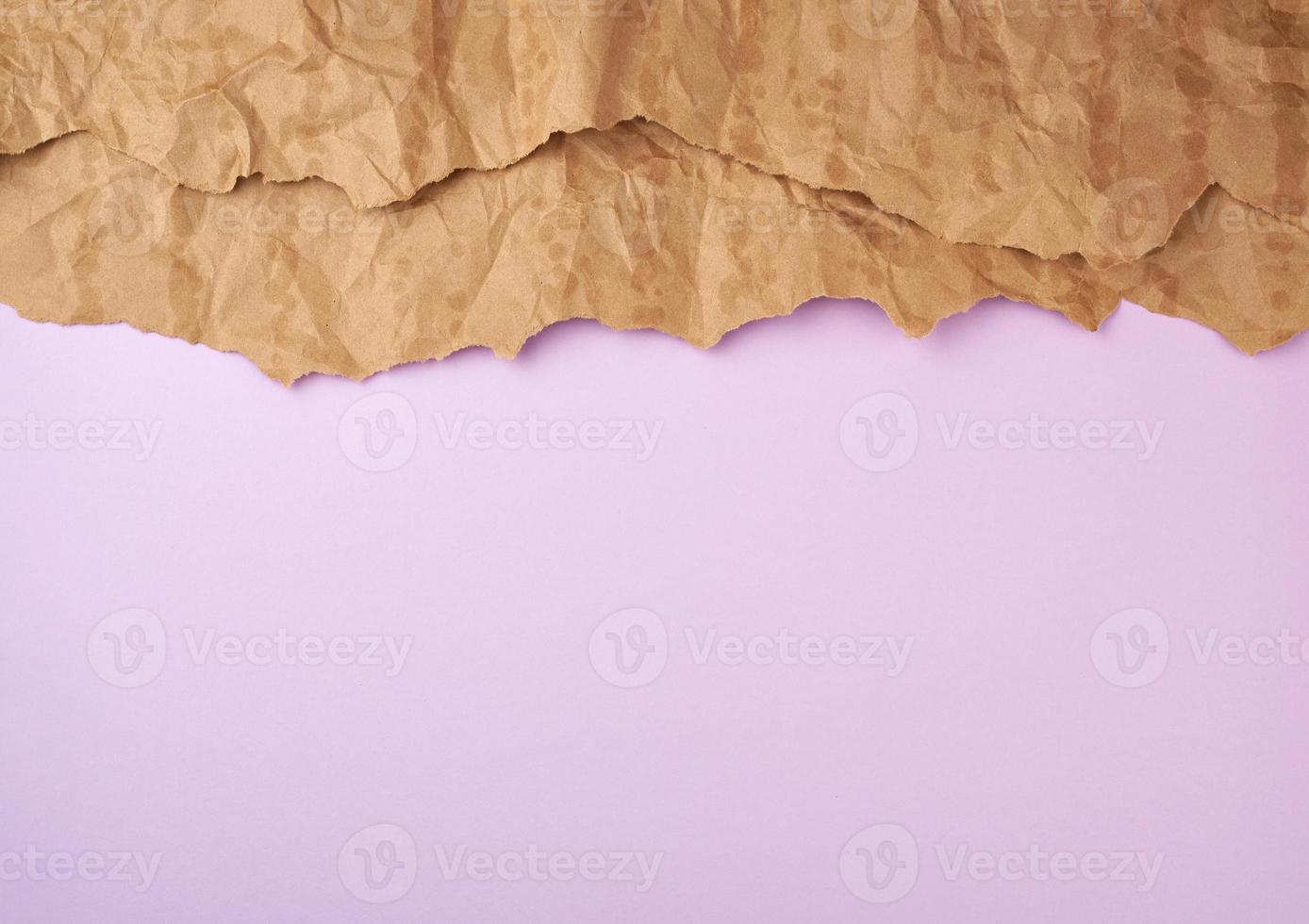 abstract lilac background with brown torn paper elements photo