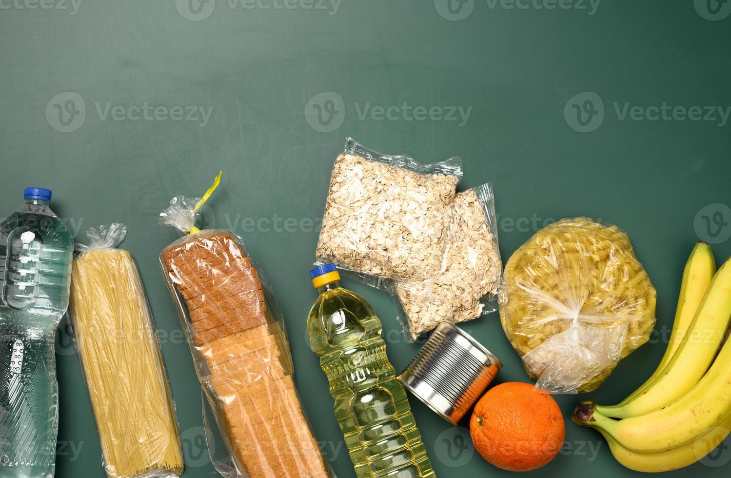 various products, fruits, pasta, sunflower oil in a plastic bottle and preservation, top view photo