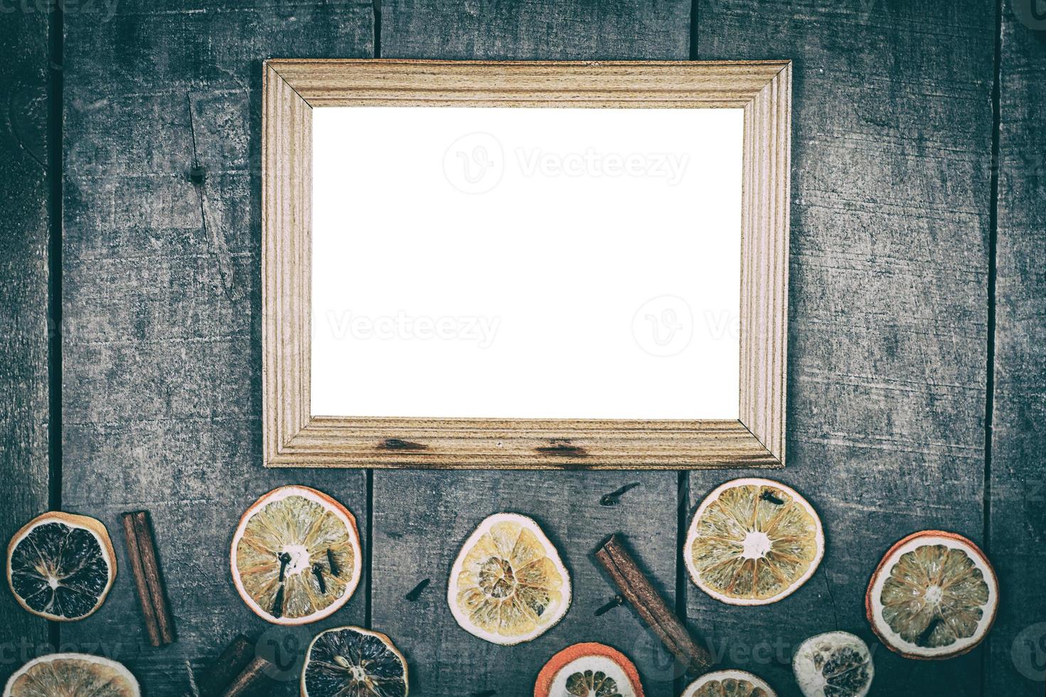 empty picture frame on a wooden surface photo