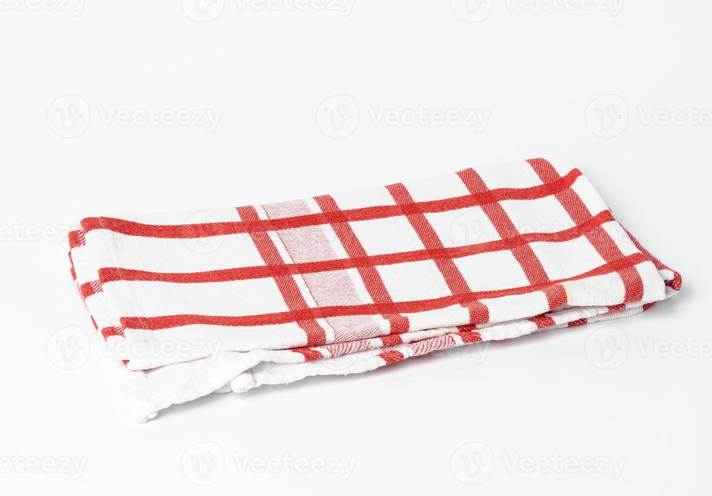folded cotton red white checkered napkin on a white background photo