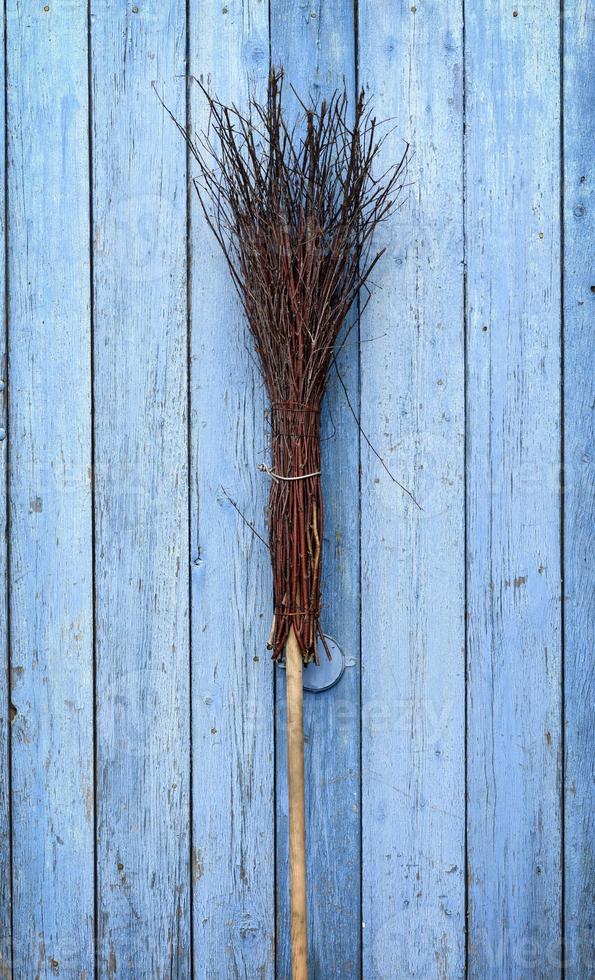 A broom with a wooden handle photo