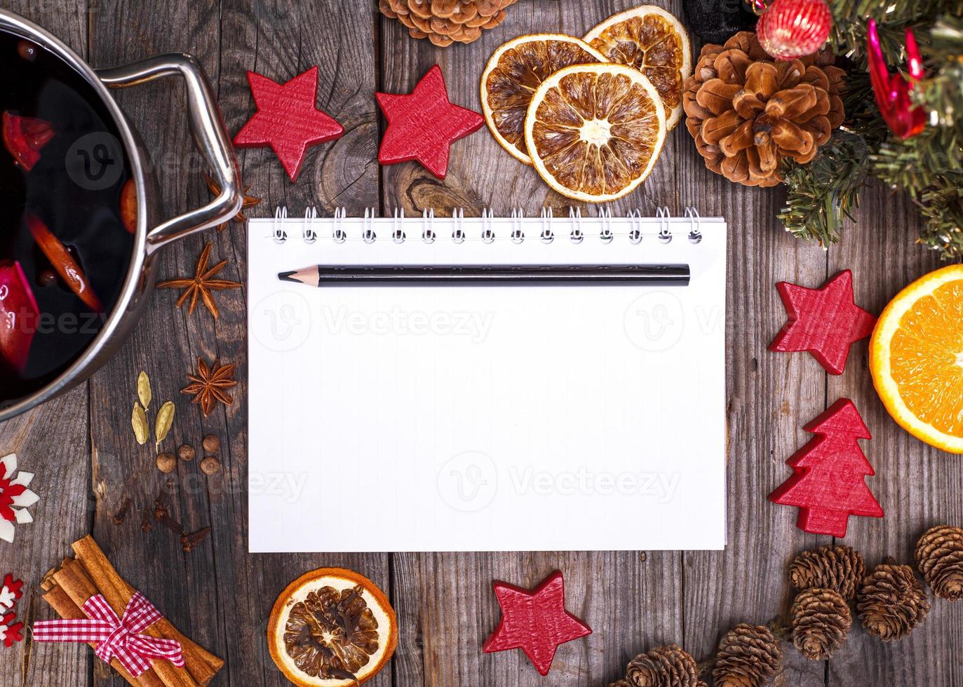 empty white paper notebook and black pencil photo