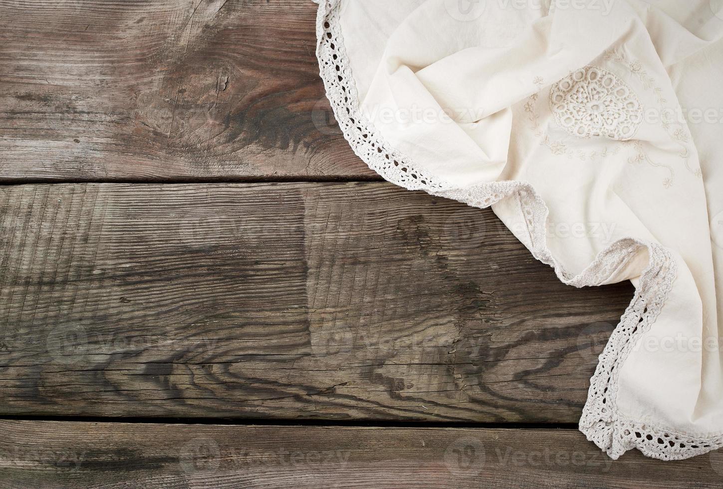 white kitchen textile towel folded on a gray wooden table from old boards photo