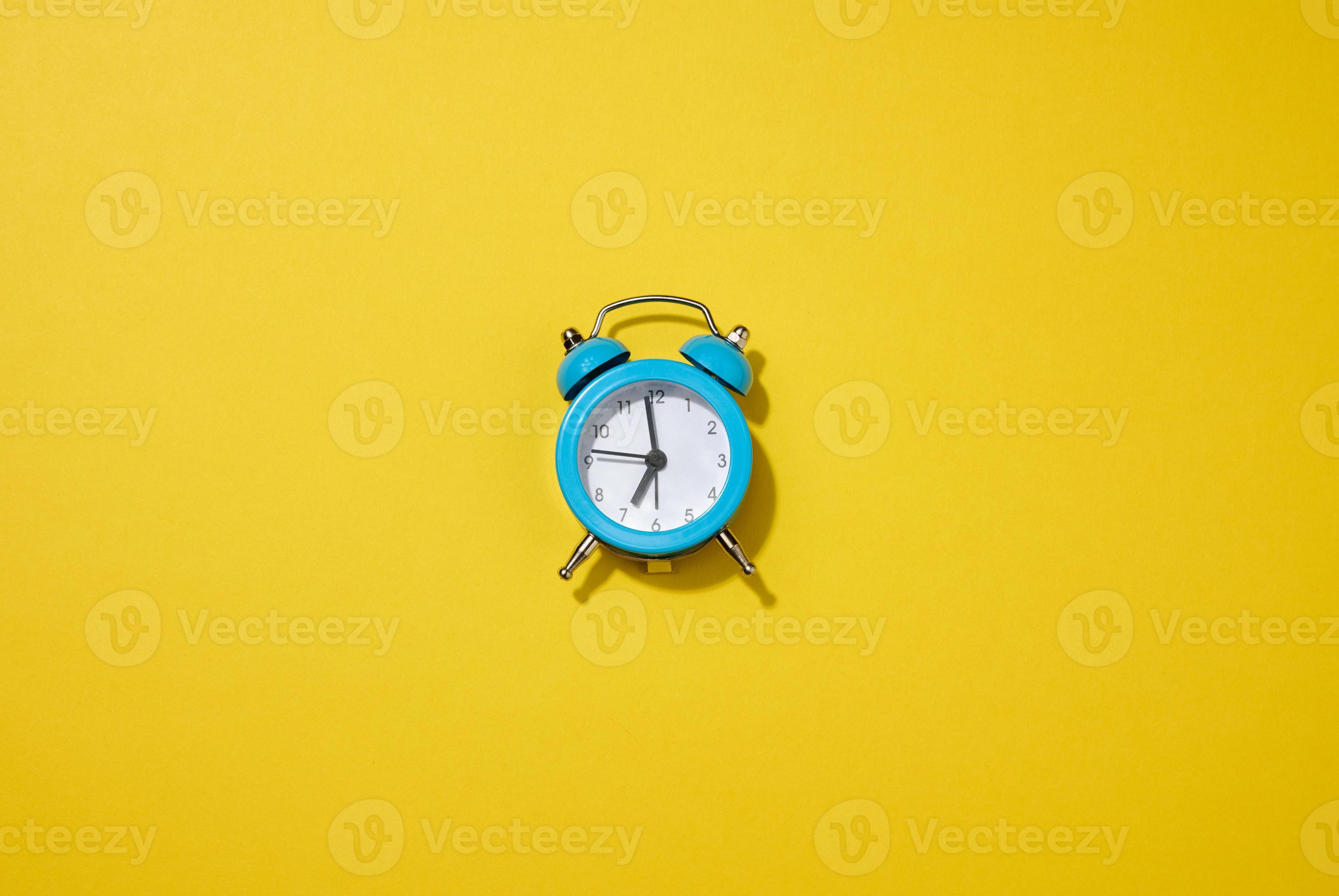 round white alarm clock on the table. Time seven in the morning, get up early 18962113 Stock