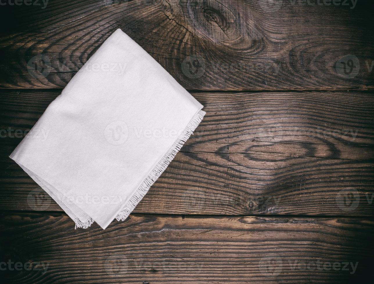 kitchen napkin on a brown wooden background photo