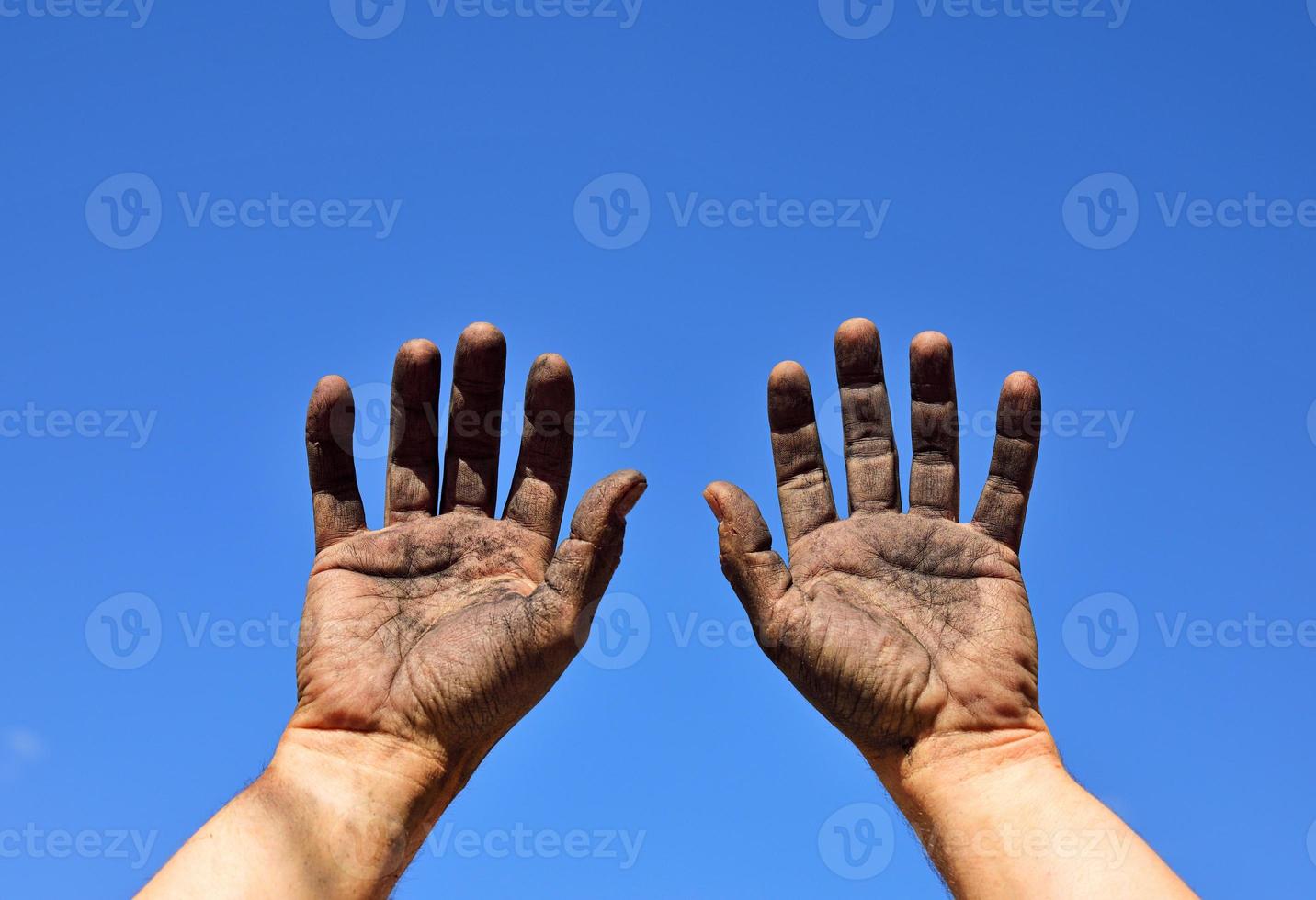 Two male hands raised up photo