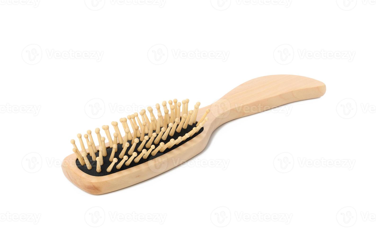 wooden hair comb isolated on white background photo