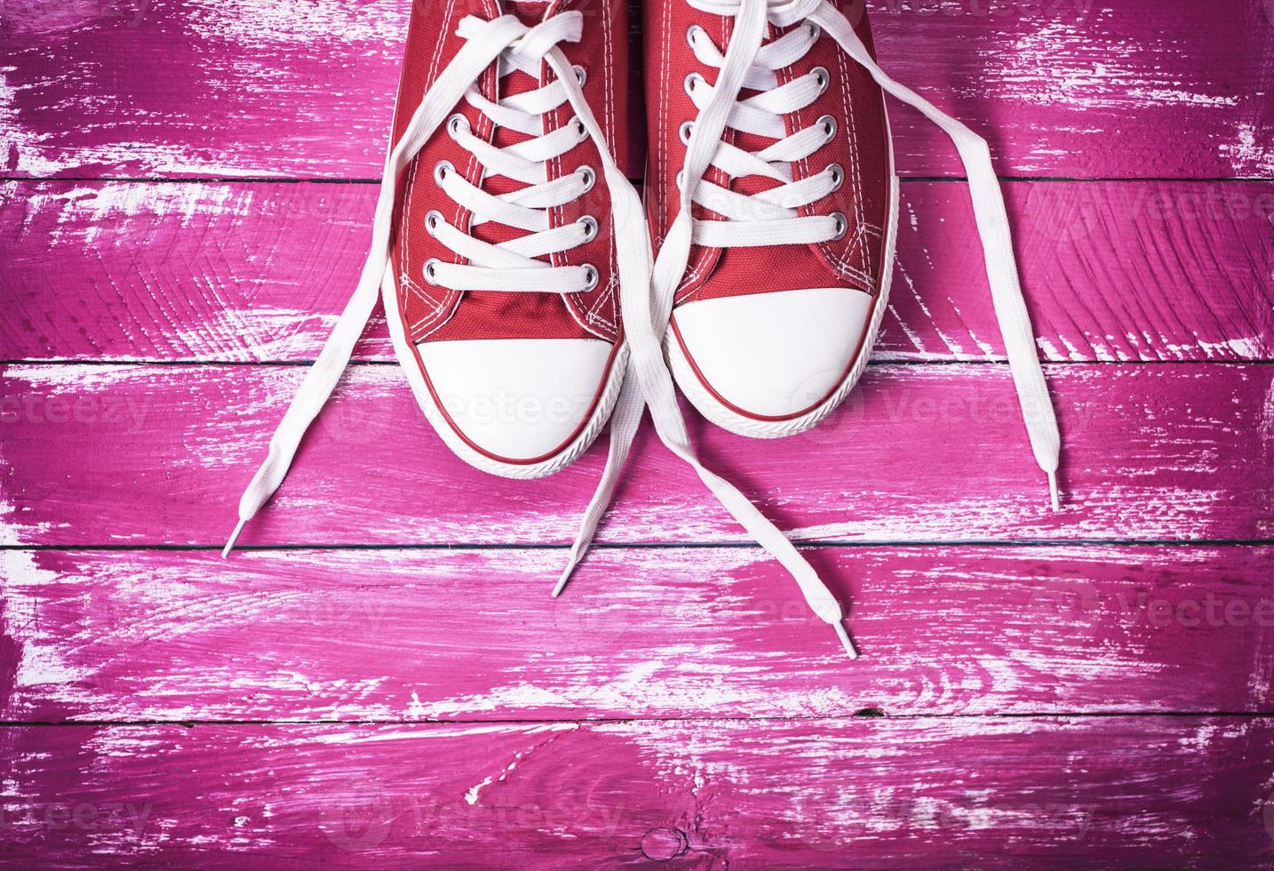 pair of red textile sneakers photo
