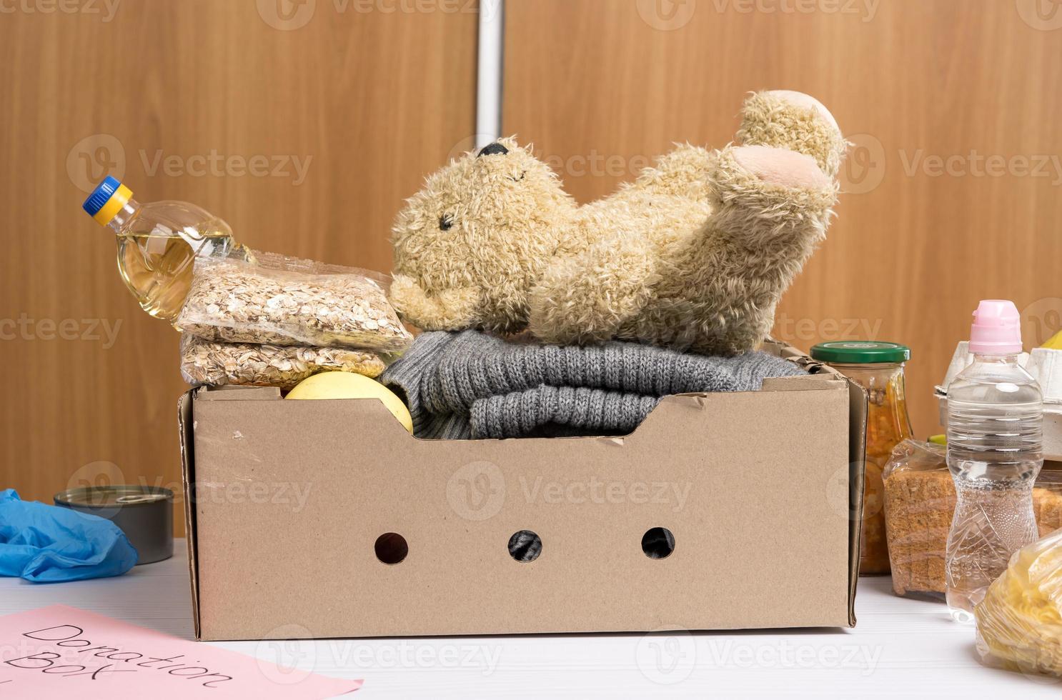 cardboard box with food and things to help those in need photo