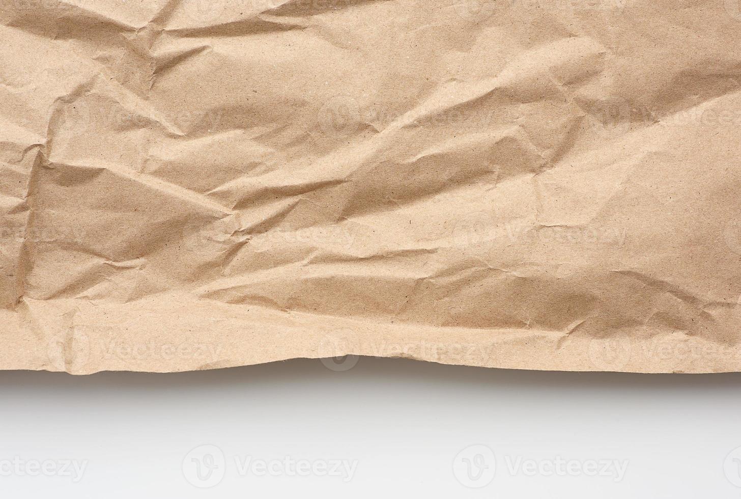 piece of crumpled blank sheet of brown wrapping paper photo