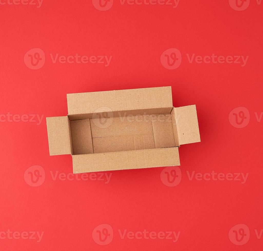 open empty square brown cardboard box for transportation and packaging of goods photo
