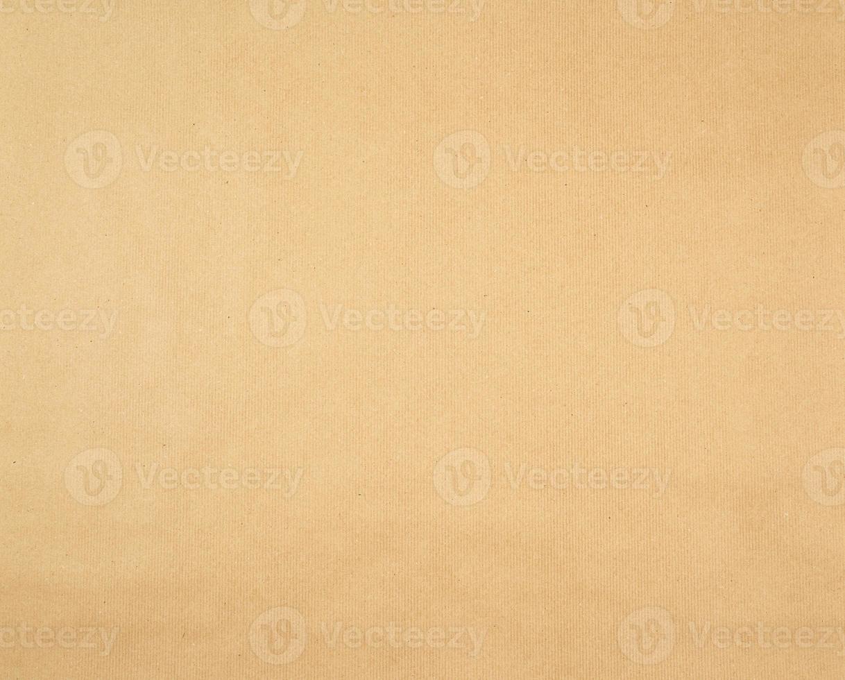 texture of smooth brown kraft wrapping paper, full frame photo