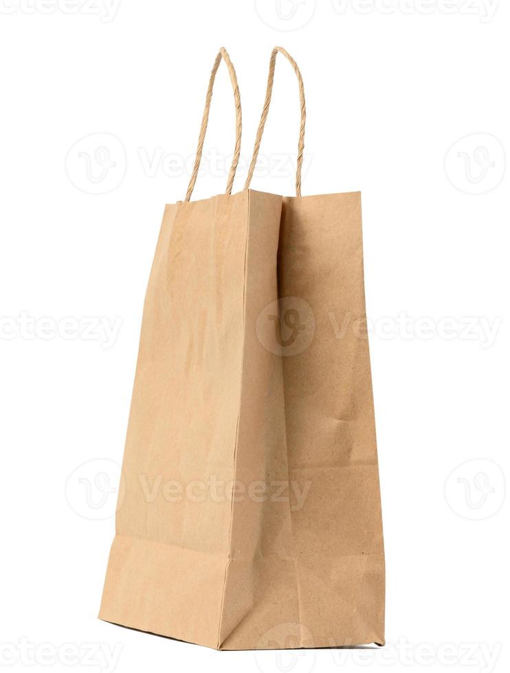 large disposable brown kraft paper bag with handles isolated on white background, eco packaging, zero waste photo