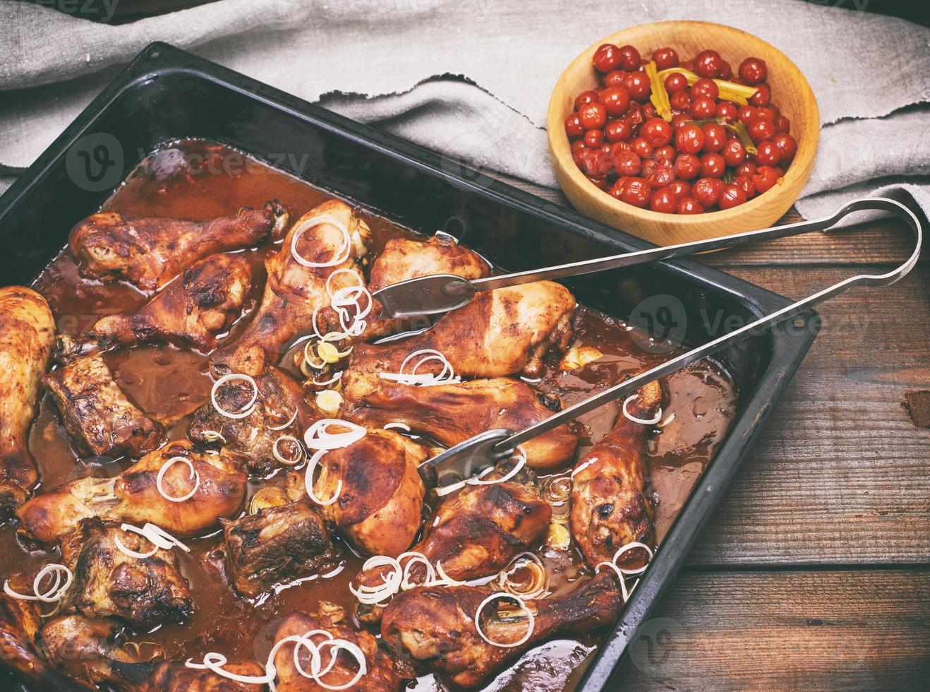 fried chicken legs with crispy crust in honey tomato sauce photo