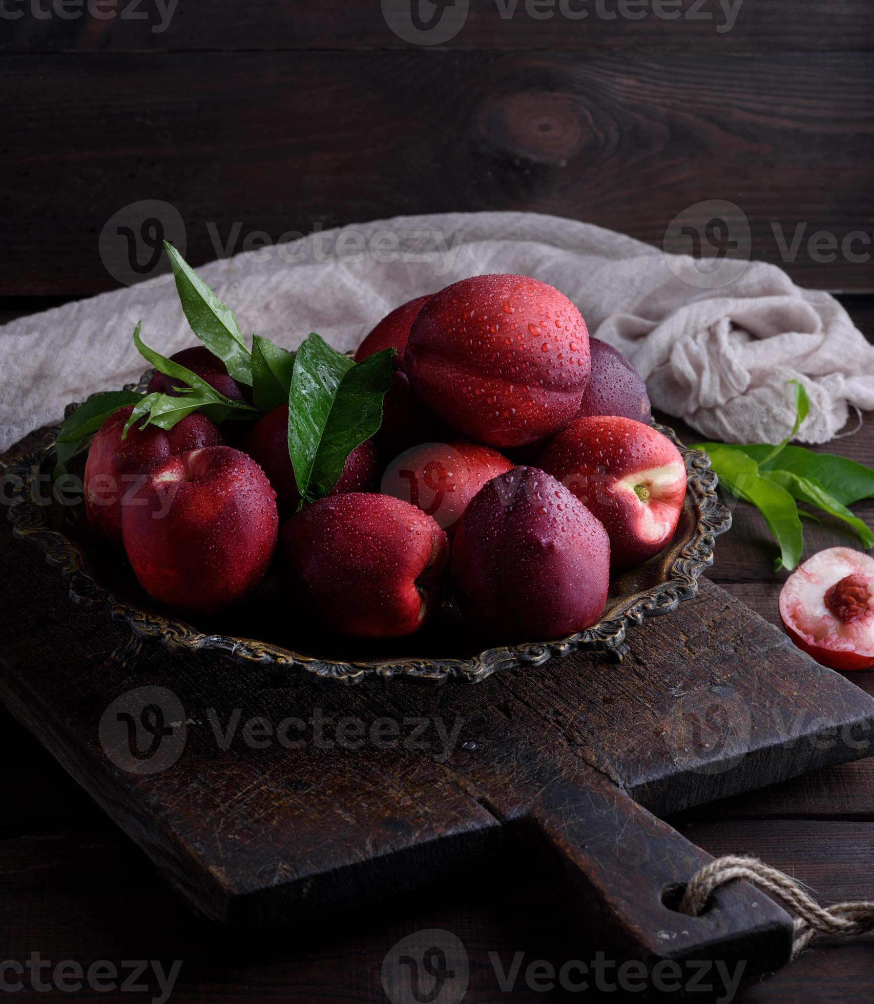 red ripe peaches nectarine in an iron plate 18962655 Stock Photo at Vecteezy