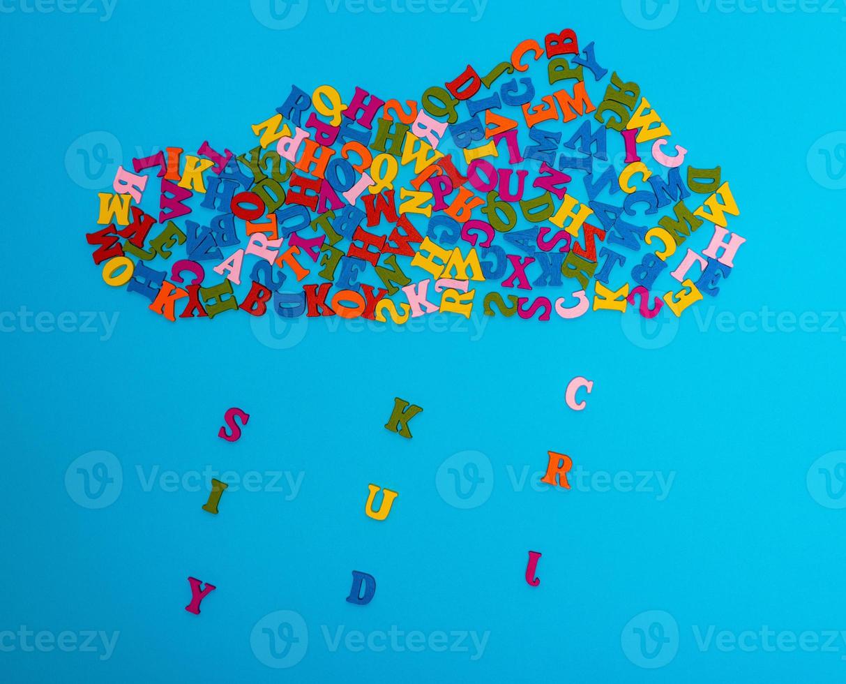 a figure of a cloud of multi-colored wooden letters photo