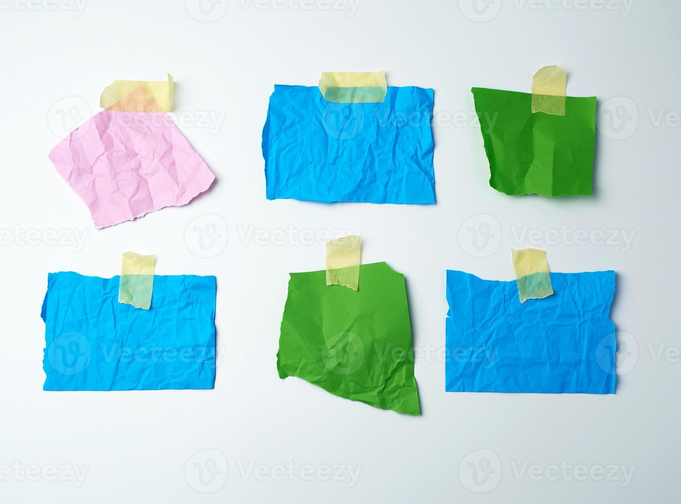empty multi-colored crumpled pieces of paper are glued with duct tape photo