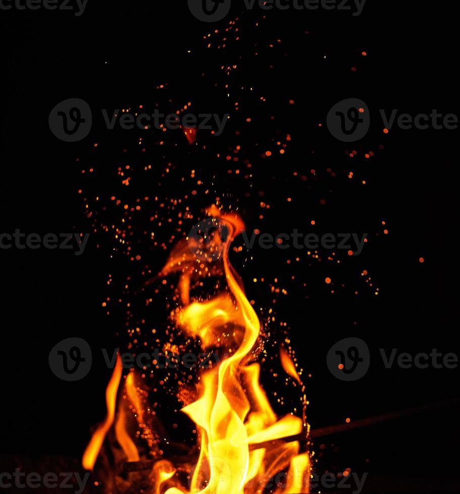 bright orange and yellow flames with sparks, photo