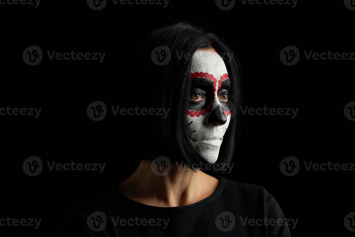 young woman with black short hair in white makeup Sugar head to the day of the dead photo