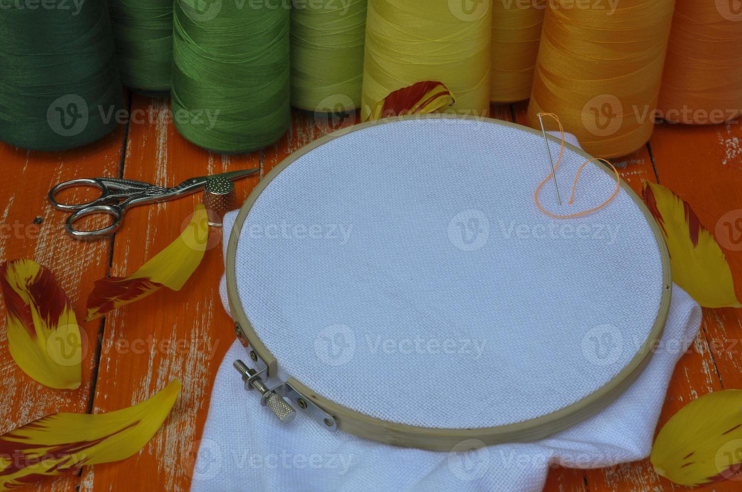 The stylized photo in orange colors of objects for needlework