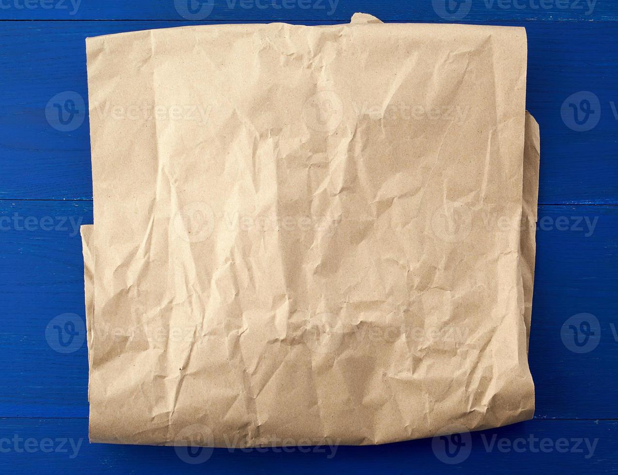 crumpled blank sheet of brown wrapping paper. Grunge texture photo