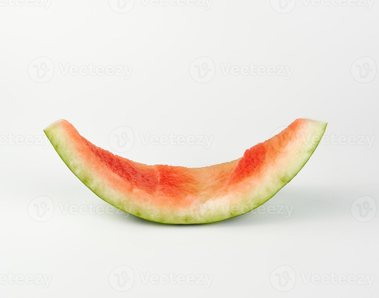 stub of red ripe round watermelon on a white background photo