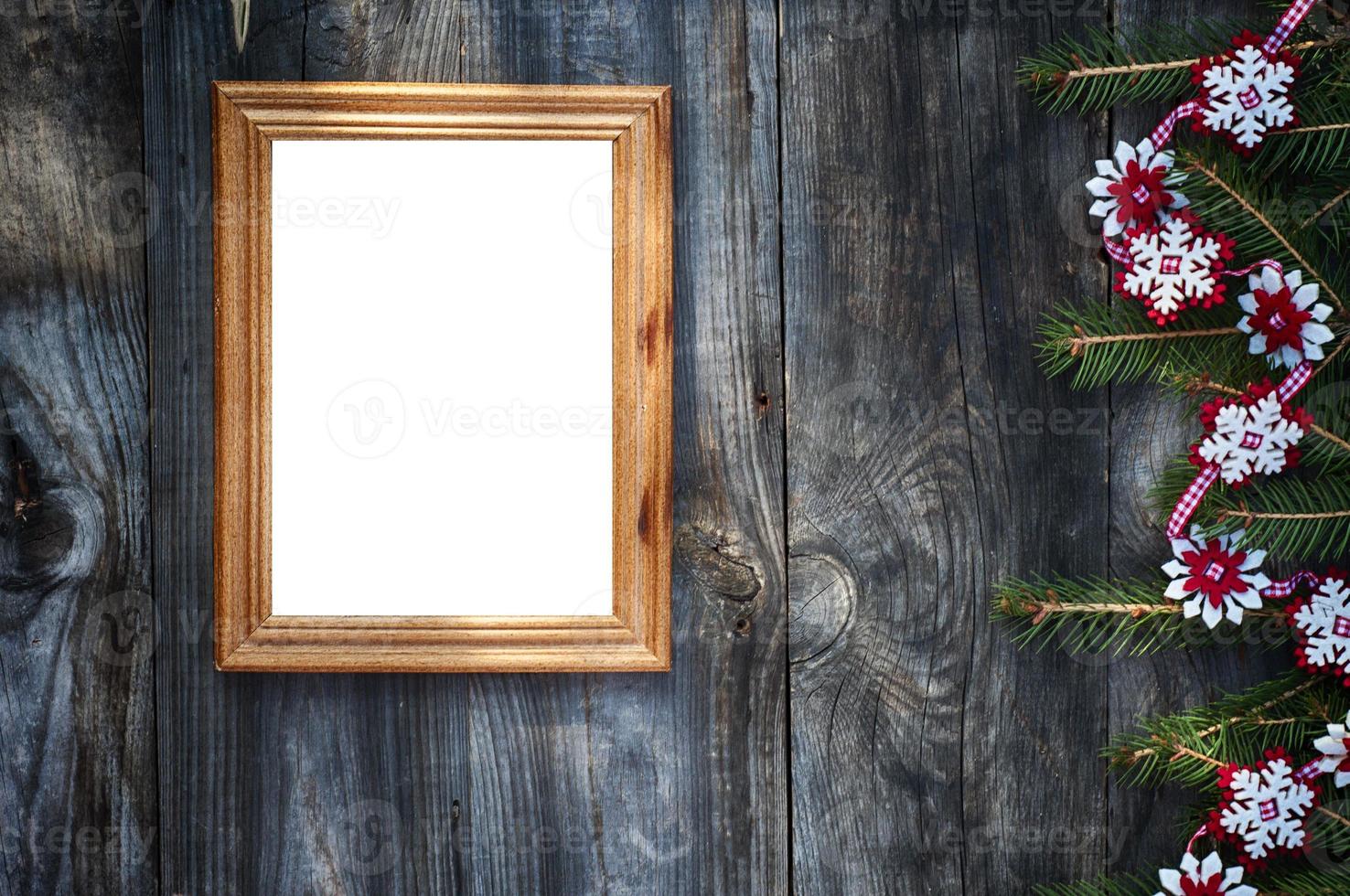 Empty wooden frame on the gray wooden surface photo