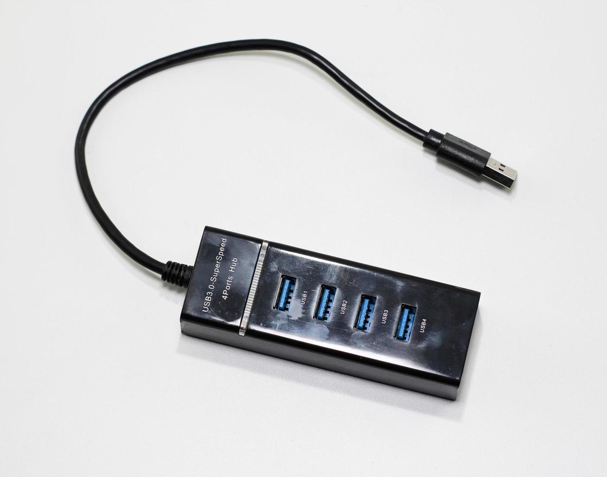 Black USB hub isolated on white.Four usb ports USB. photo