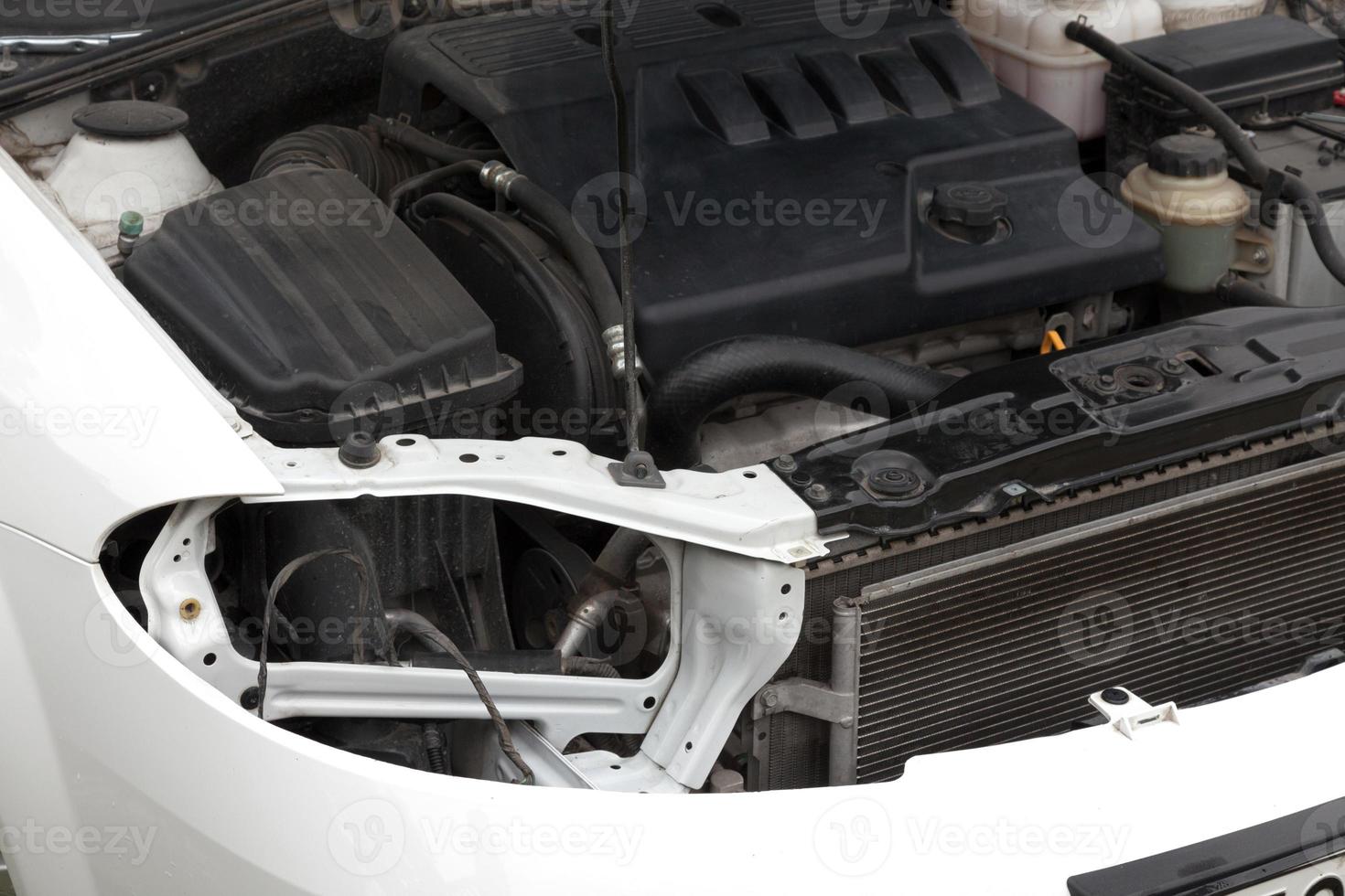 Malfunctioning car with opened hood photo