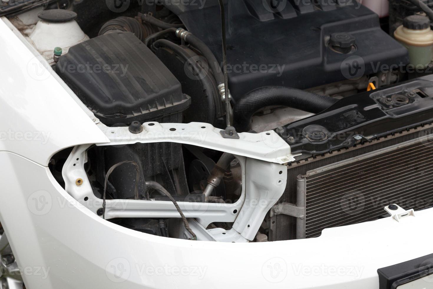 Malfunctioning car with opened hood photo