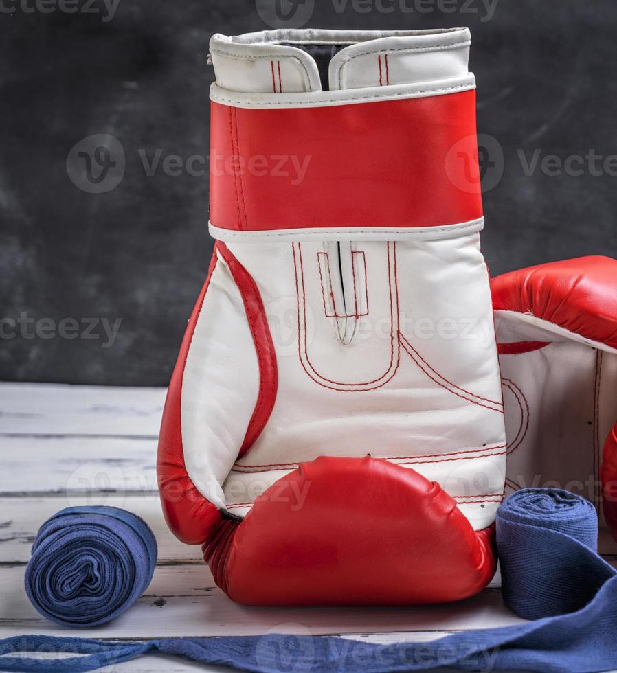 red-white boxing gloves and a blue textile bandage photo